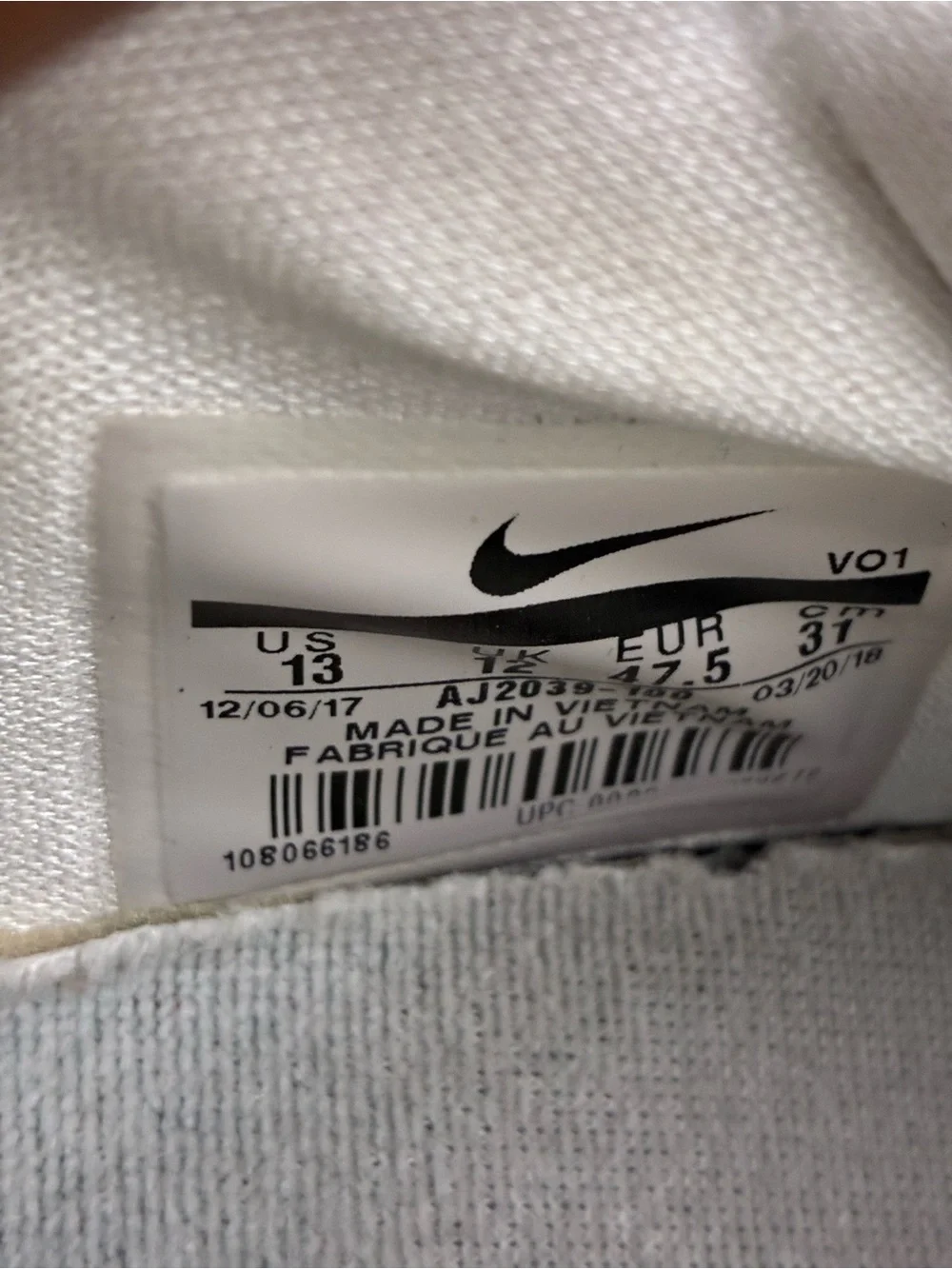 Nike White Youth Athletic Sneakers with Blue & Orange Accents